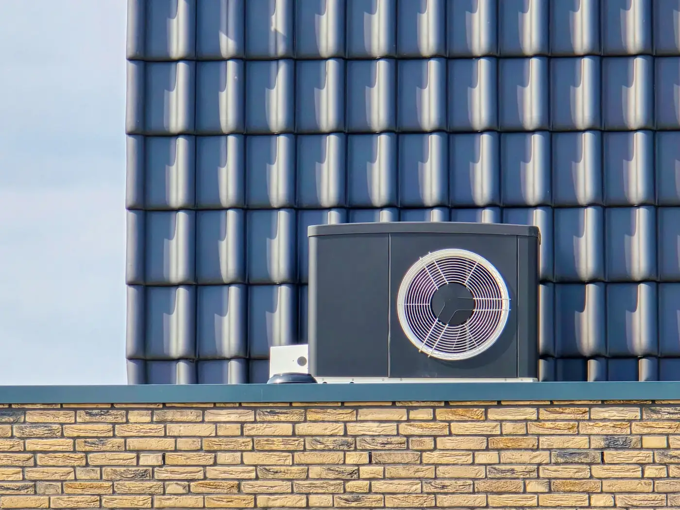Air source heat pump unit installed outdoors at commercial property