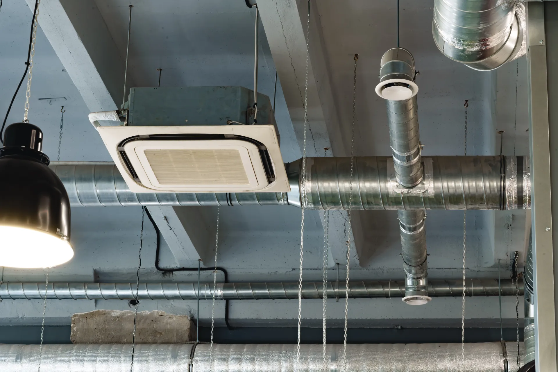 Silver ventilation pipes representing building automation and ventilation system integration in GTA condominiums